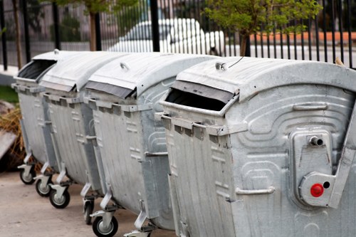 Business professionals managing waste removal in an office setting in Kenton