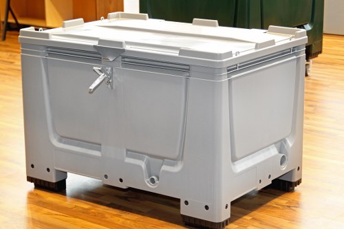 Workers clearing debris from a refurbishment project to illustrate cubic-yard pricing